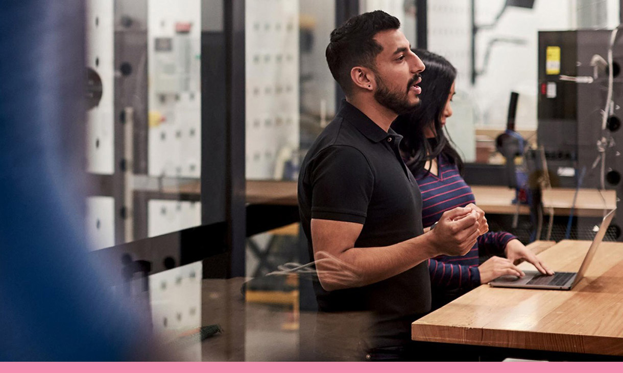 Two coworkers in a meeting.