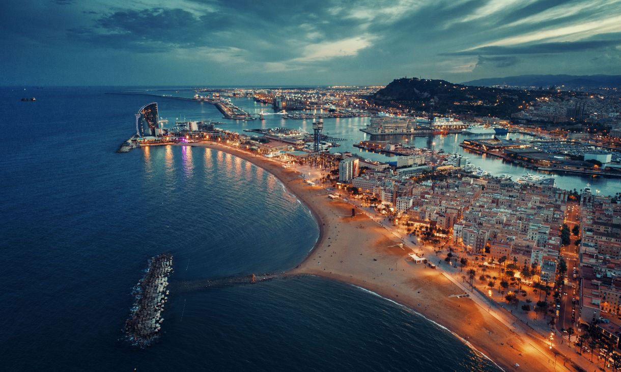Bird's eye view of buildings along a beach at night